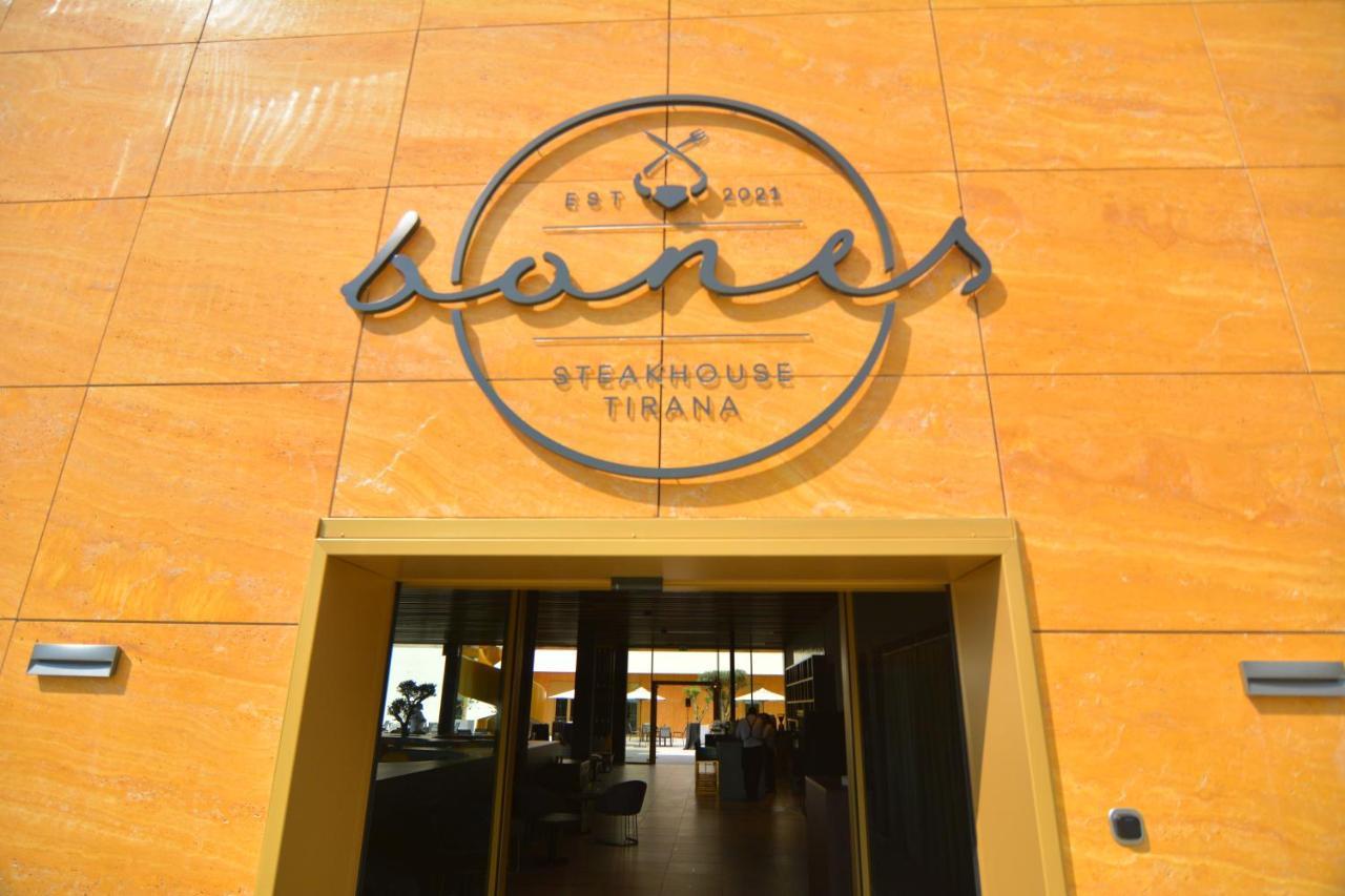 mk hotel tirana Rinas Bagian luar foto Entrance of the restaurant