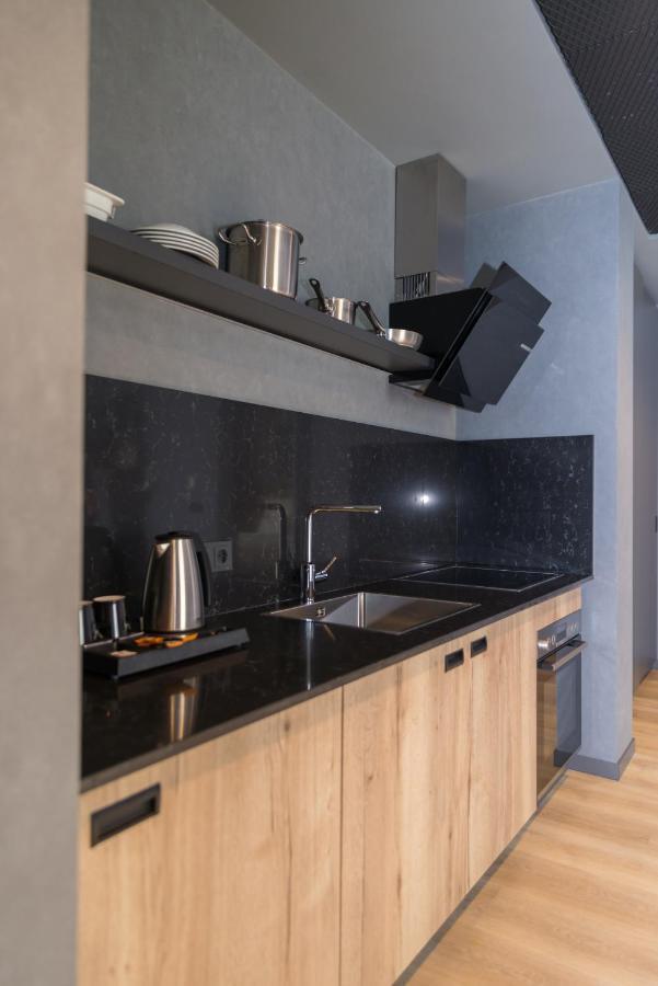 mk hotel tirana Rinas Bagian luar foto A kitchen in a serviced apartment in Paris