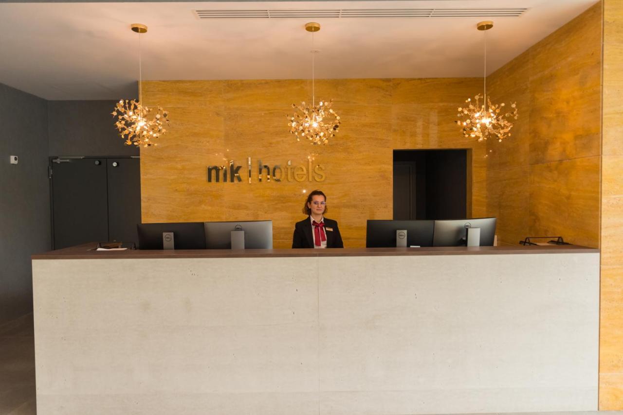 mk hotel tirana Rinas Bagian luar foto Reception desk at a hotel
